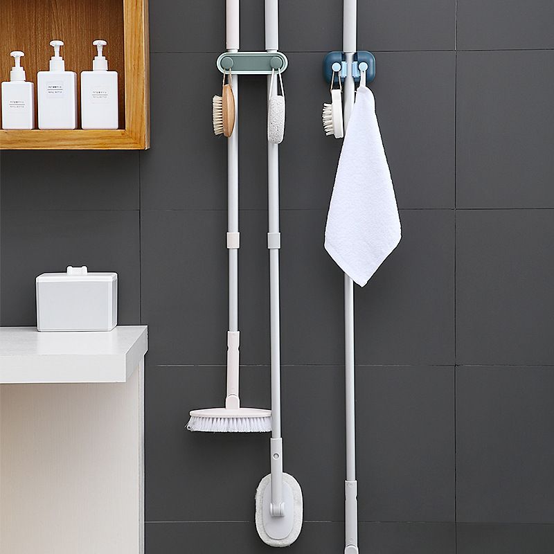 Multi-functional wall-mounted, no need for drilling, space-saving, double slots with 2 hooks, traceless mop clamp, toilet brush, broom slot Item Picture