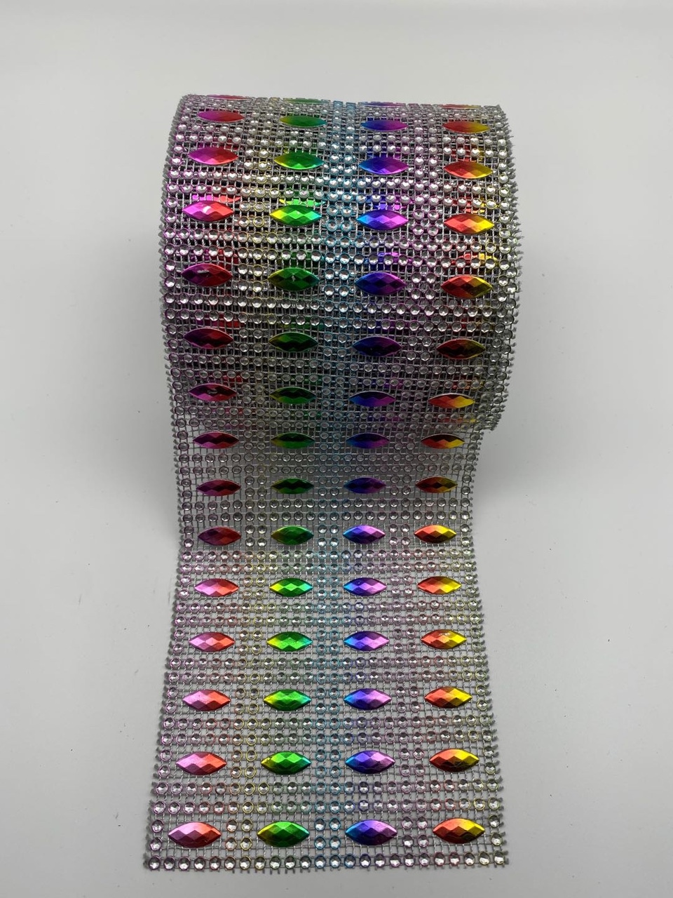 Four rows of rhomboids, silver background with seven colors