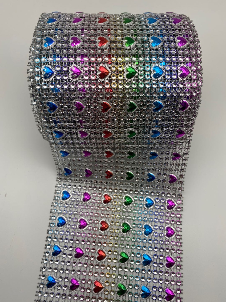 Six rows of hearts, silver background with seven colors