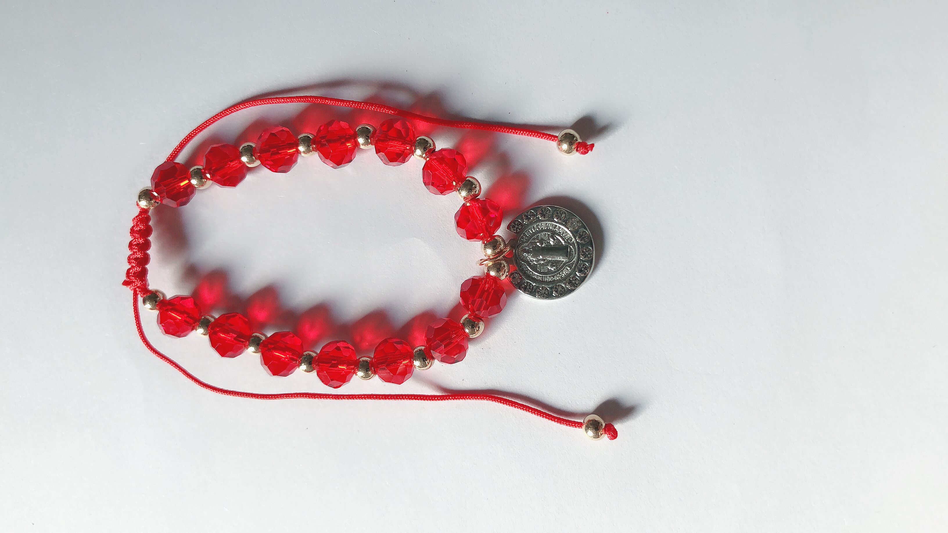 Braided bracelet worn with crystal ends flat combined with gold round dot diamond Jesus thumbnail