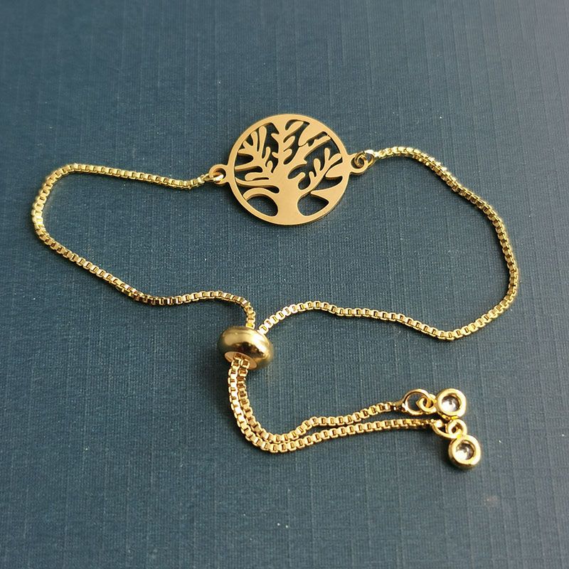 Factory wholesale personalized European and American style golden hollowed-out life tree pattern double-hole connection bracelet necklace accessories Application Scenario