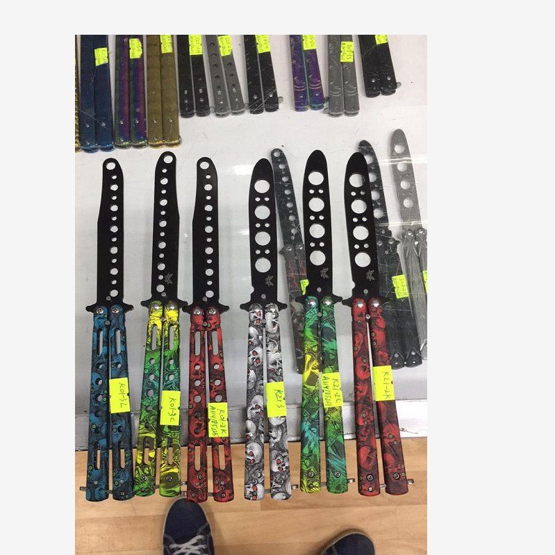 Seven-hole camouflage butterfly knife, butterfly knife swing knife, all-steel practice folding knife toy, outdoor training for beginners