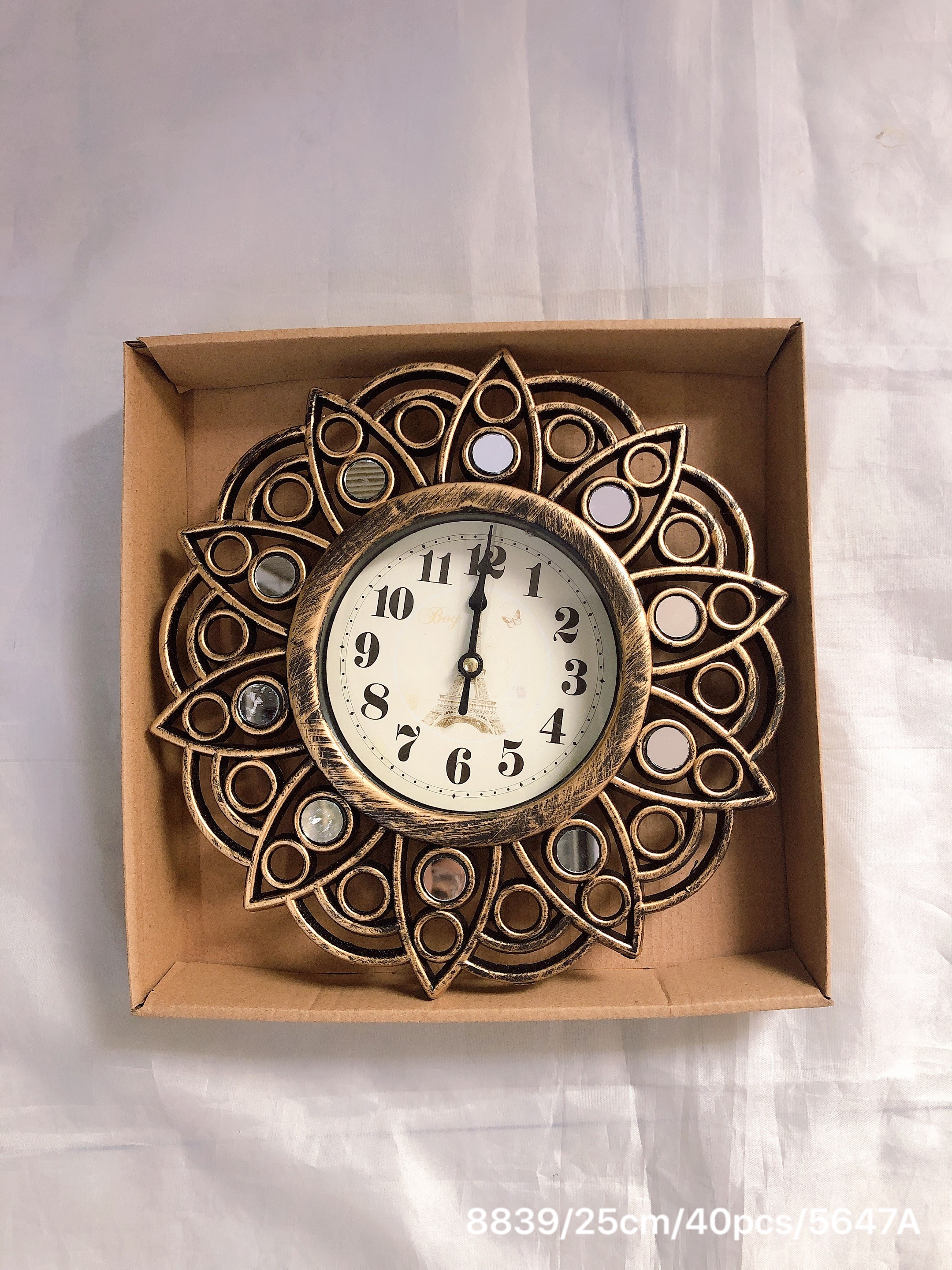 A 25cm wall clock with a retro hollowed-out quartz design for the living room detail image 4