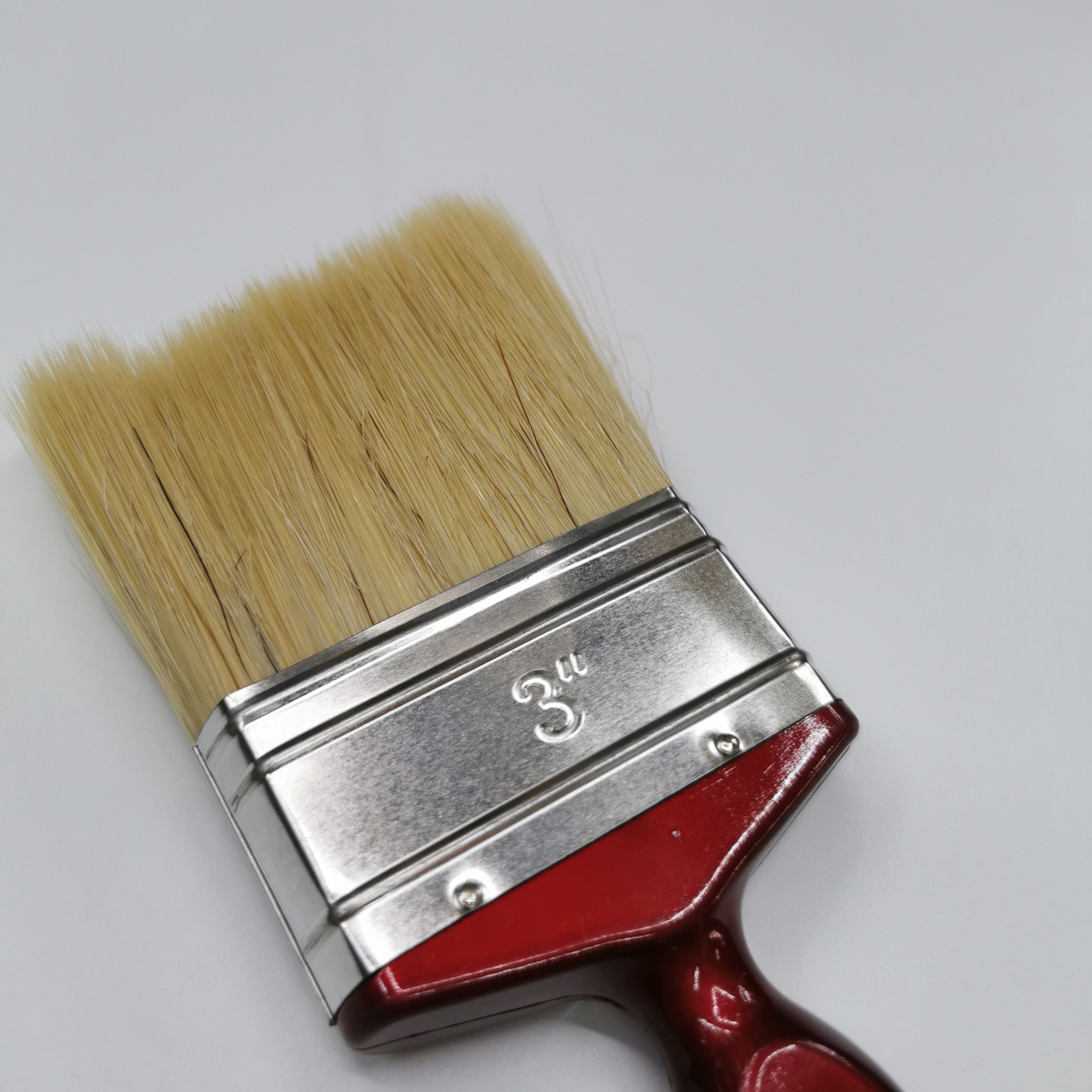 A popular and practical wall-painting tool, a red plastic-handled white bristle brush Specification image