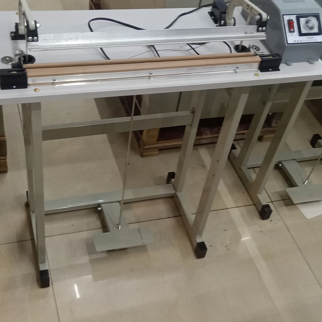 Foot-operated sealing machine