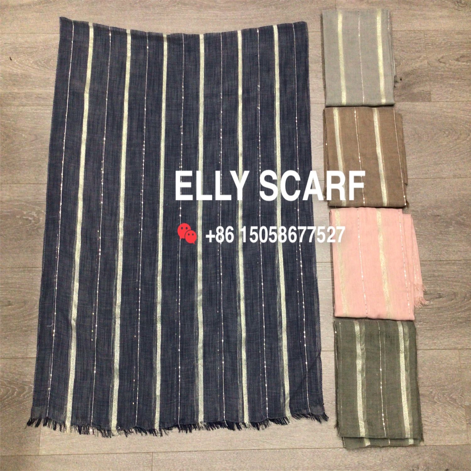 A gold-threaded vertical striped and sequined woven scarf