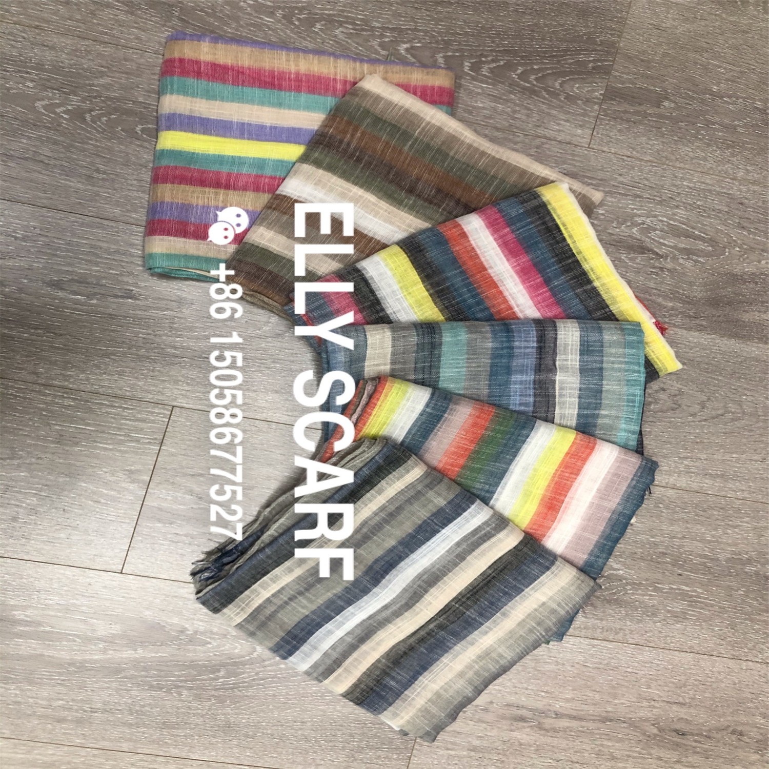 A vertical striped rainbow-colored scarf made of linen and cotton detail image 1