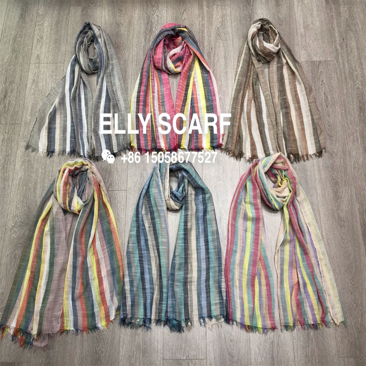 A vertical striped rainbow-colored scarf made of linen and cotton