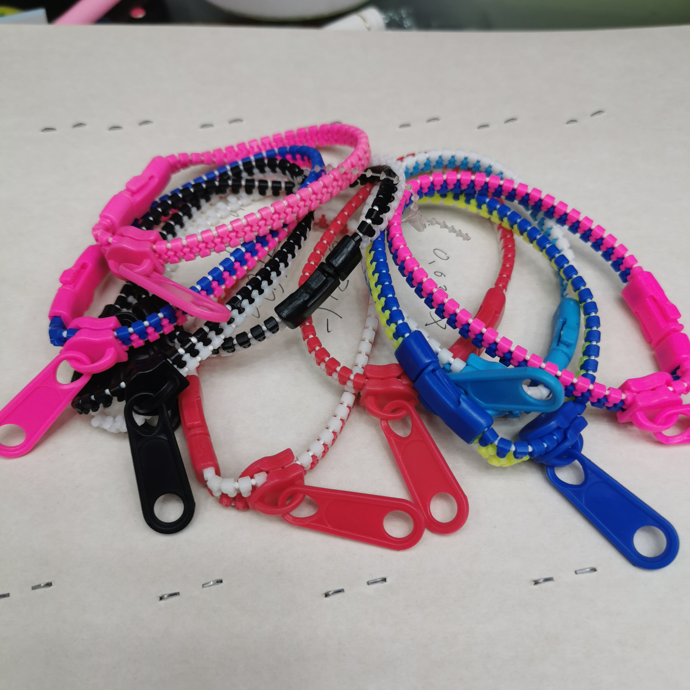 Kids' zipper bracelets come in a variety of colors