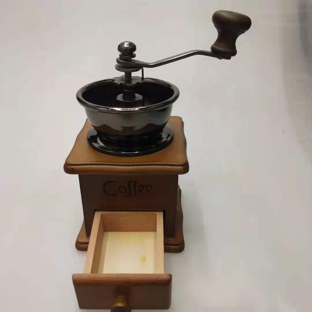 A classic, retro and practical hand-cranked coffee grinder with a ceramic steel core, an entry-level coffee grinder details Picture