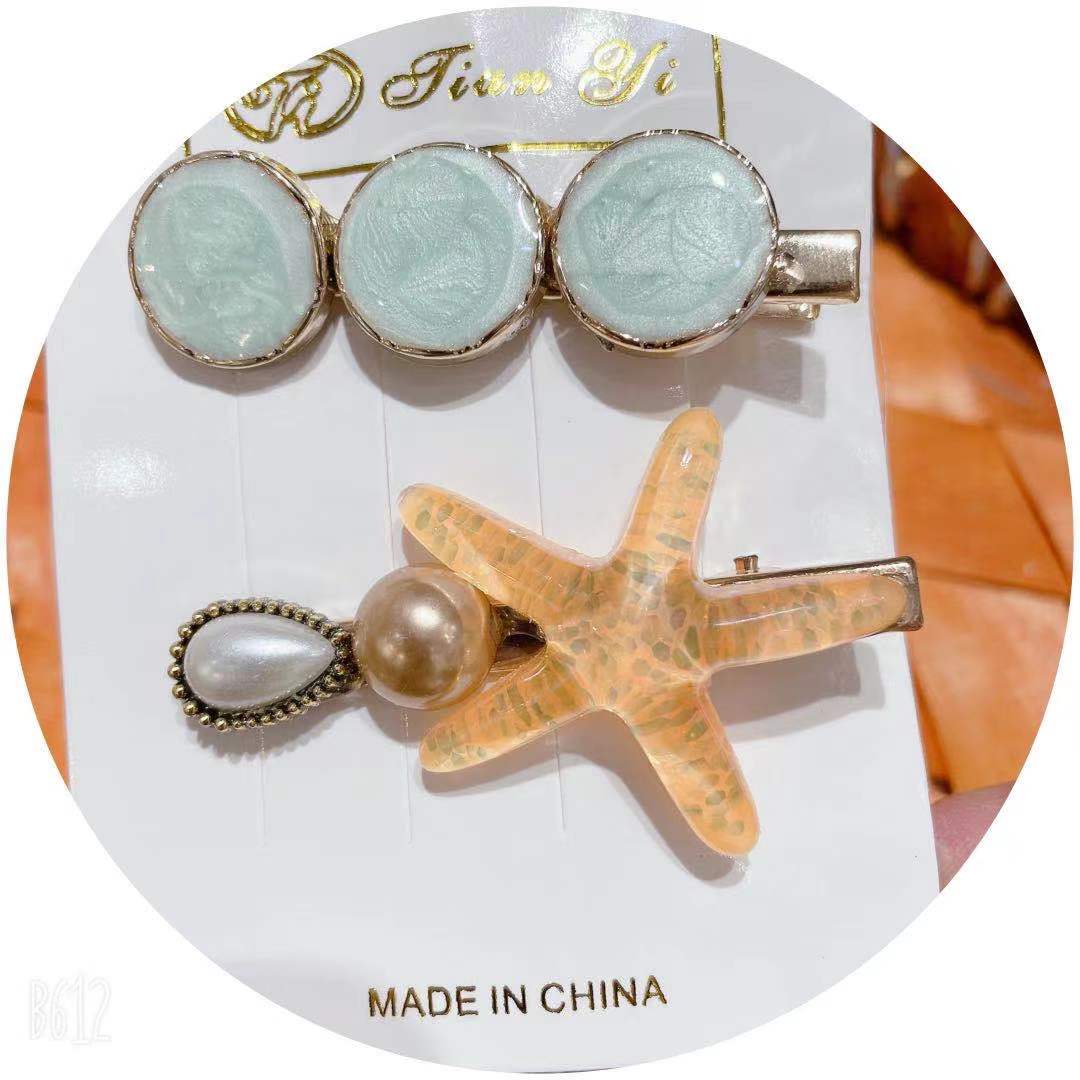 天意饰品 网红爆款 女士时尚高端    合金橘色海星⭐两件鸭夹组合套装