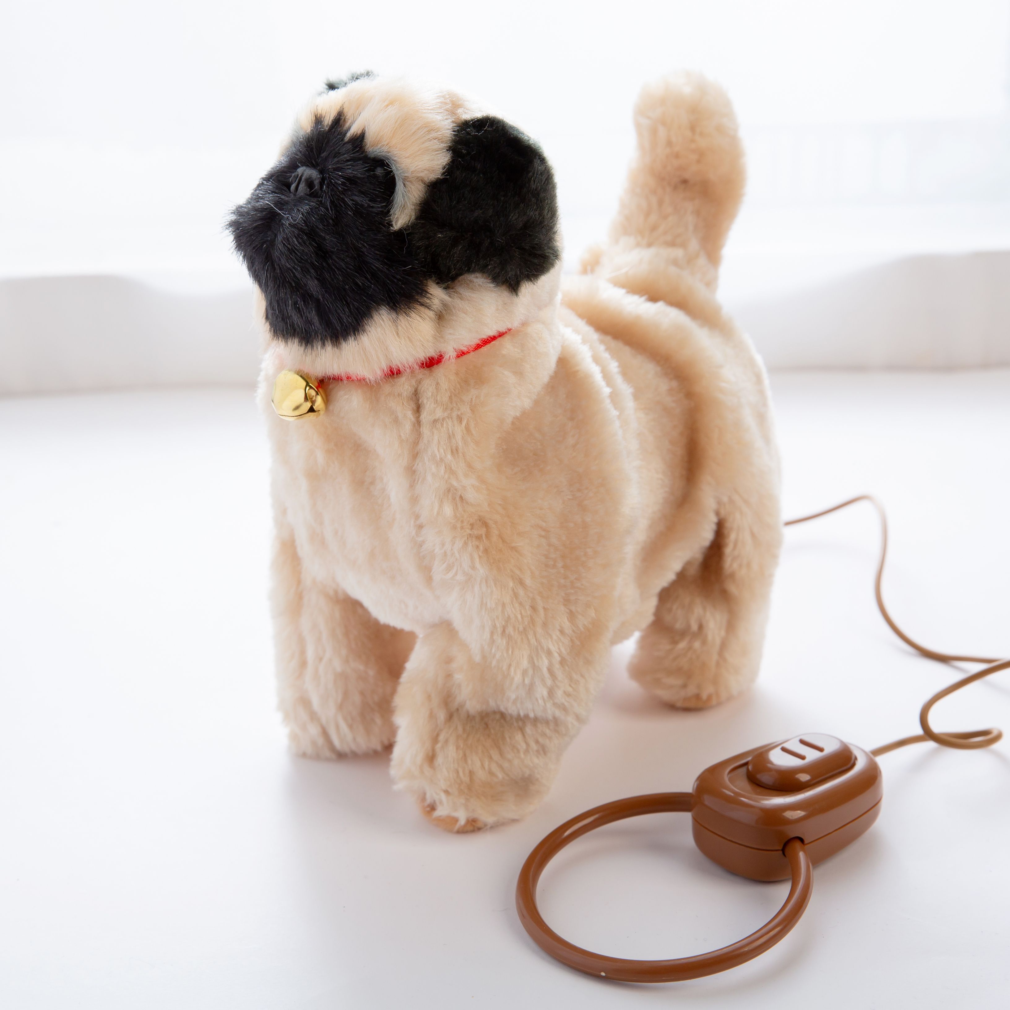 A dog that walks back and forth with its tail moving and to music Item Picture