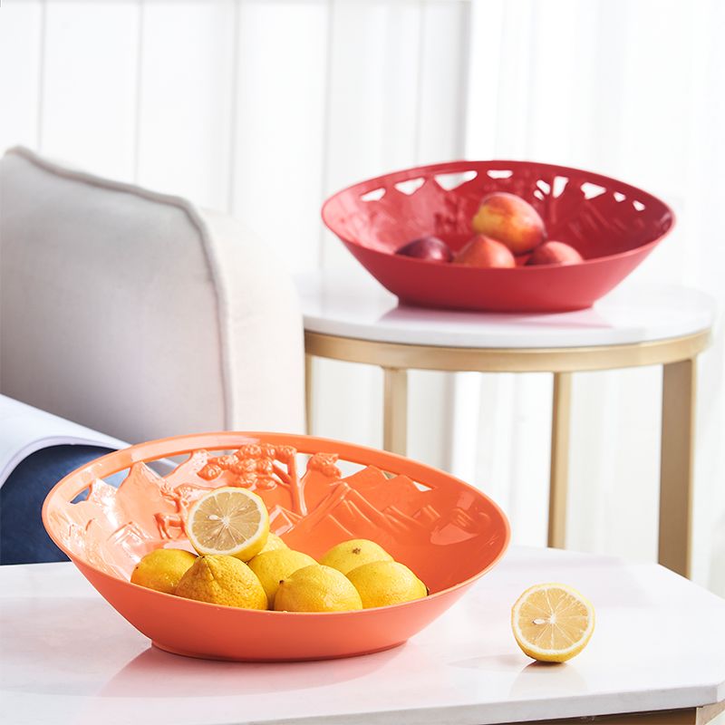 Factory wholesale of simple plastic plates, household snack and fruit storage plates, creative hollowed-out fruit plates in stock Application Scenario