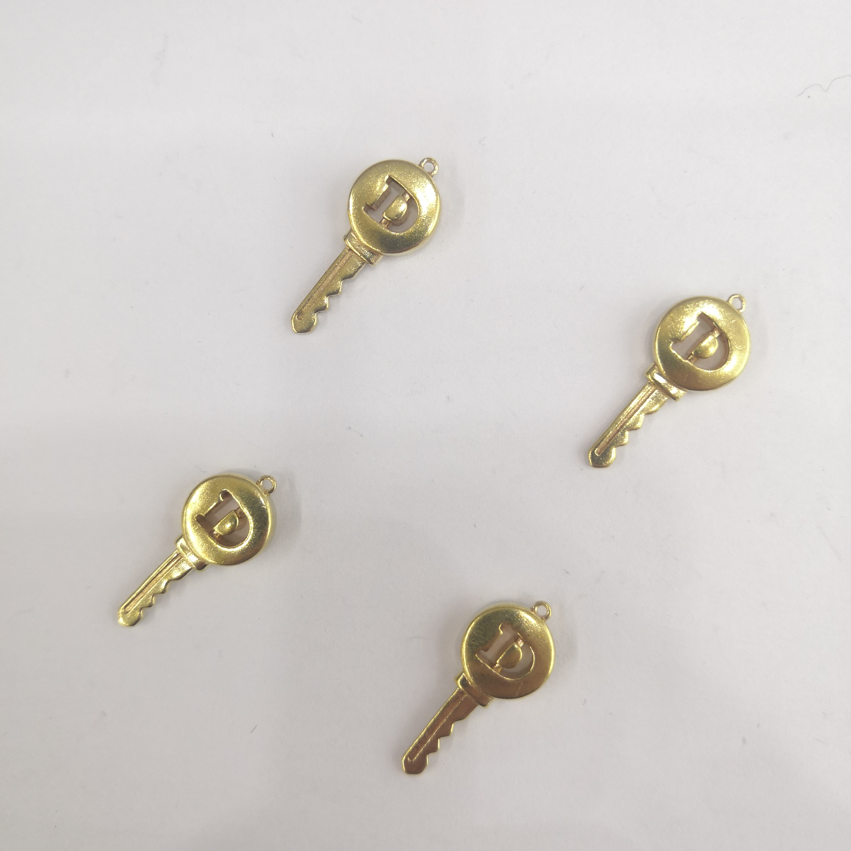 Cast copper hollow letter D key a hanging