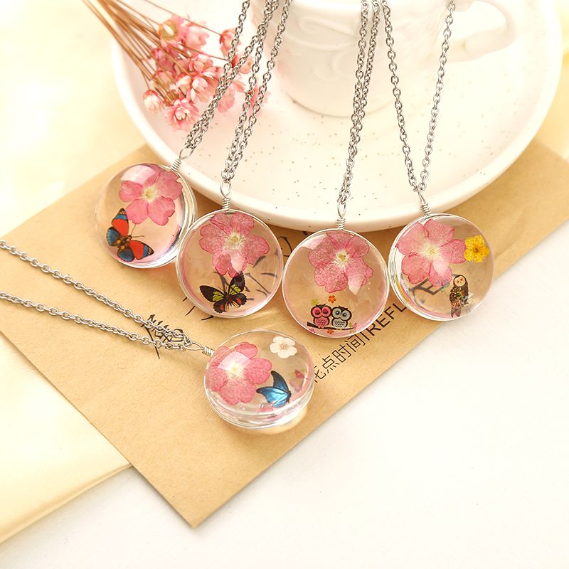 A dried flower necklace pendant