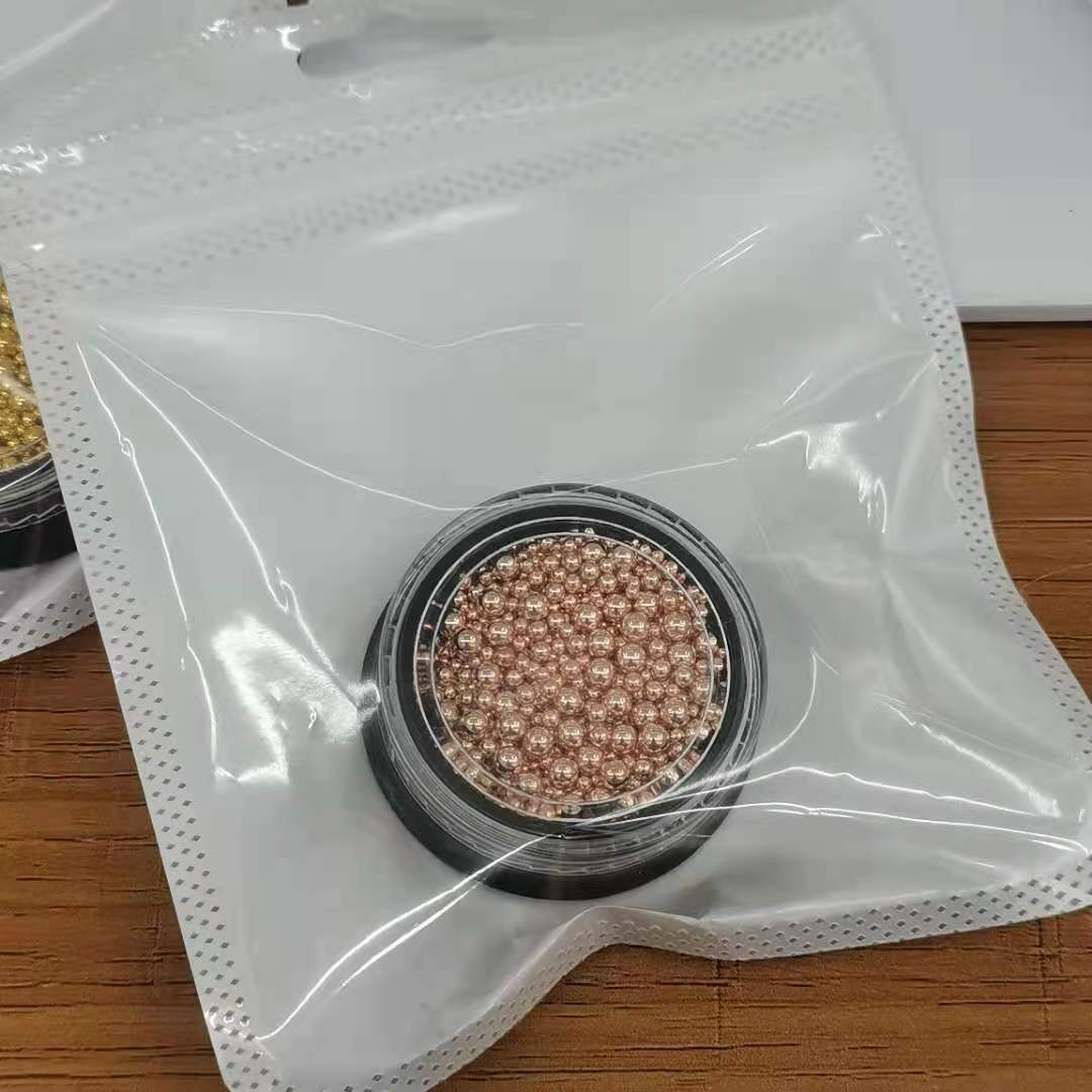 Direct sales from the manufacturer of small steel ball nail art accessories mixed with champagne-colored caviar alloy metal full figure