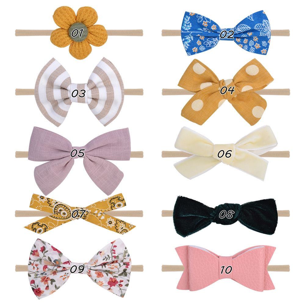 A 10-piece set of handcrafted fabric bow headband
