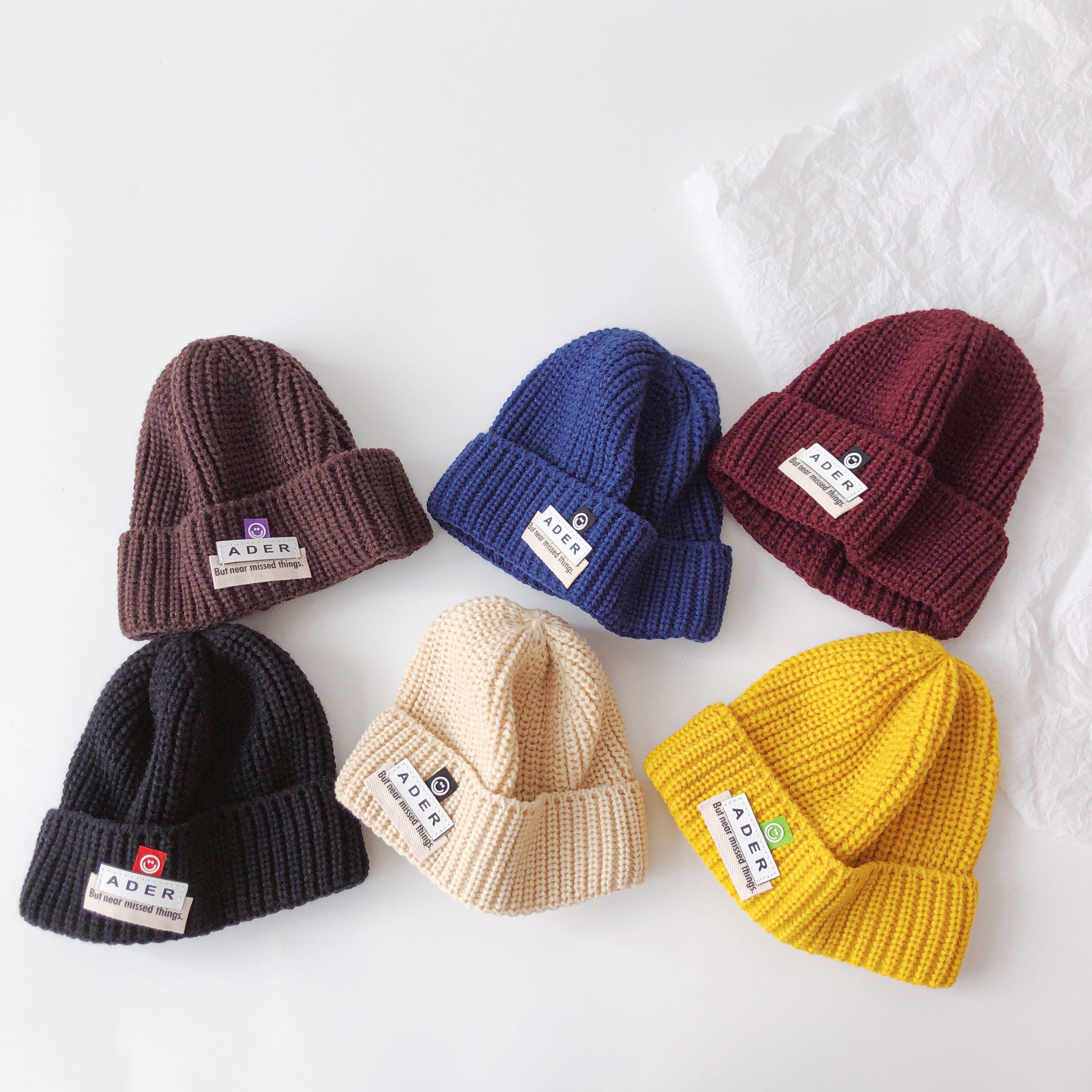 韩版儿童针织帽笑脸字母贴标秋冬季休闲时尚纯色男童女童毛线帽潮