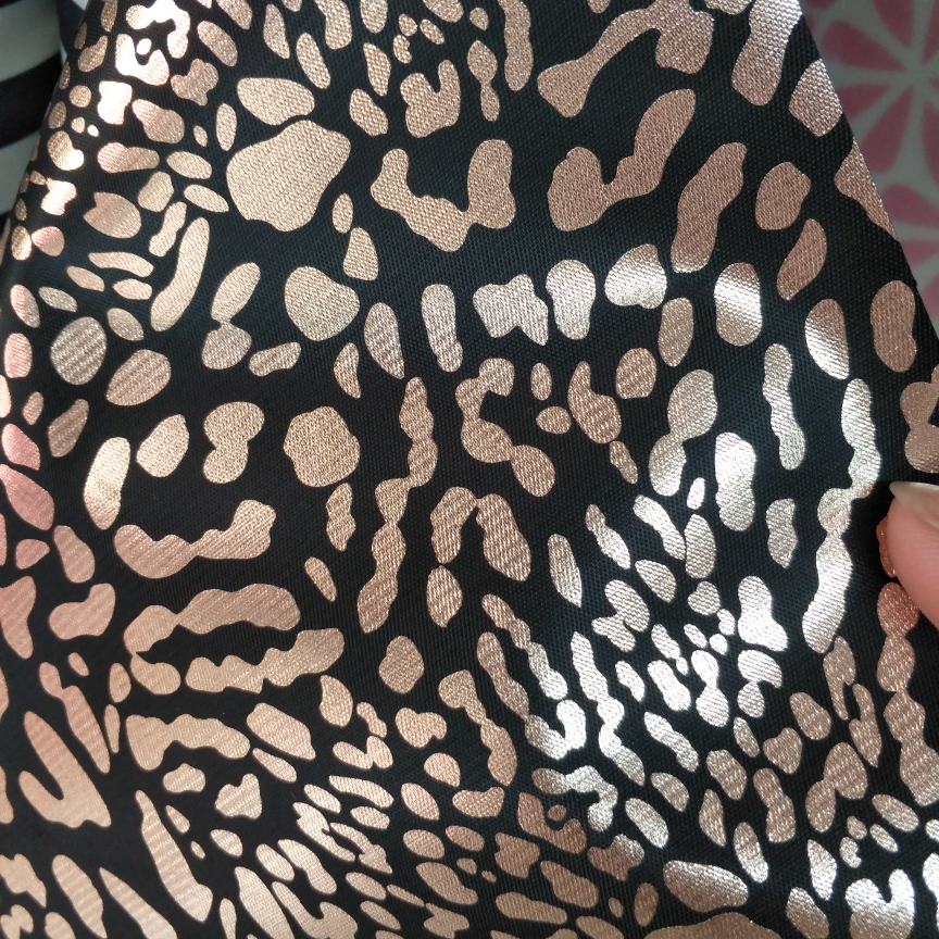 Gold leopard print on black cloth