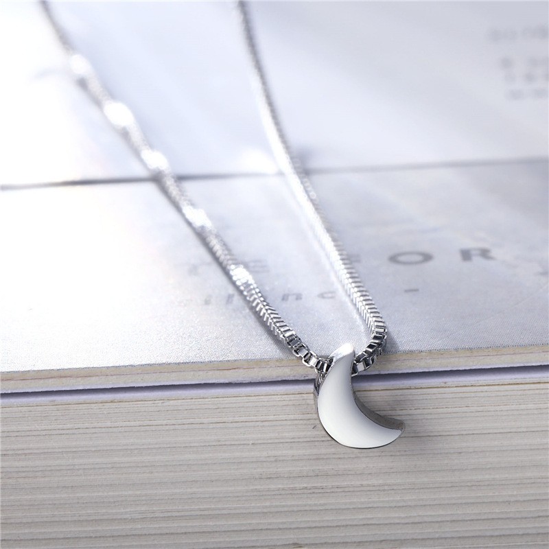 A high-end, simple and niche necklace for women with a perforated moon-shaped pendant from Europe and America detail image 3