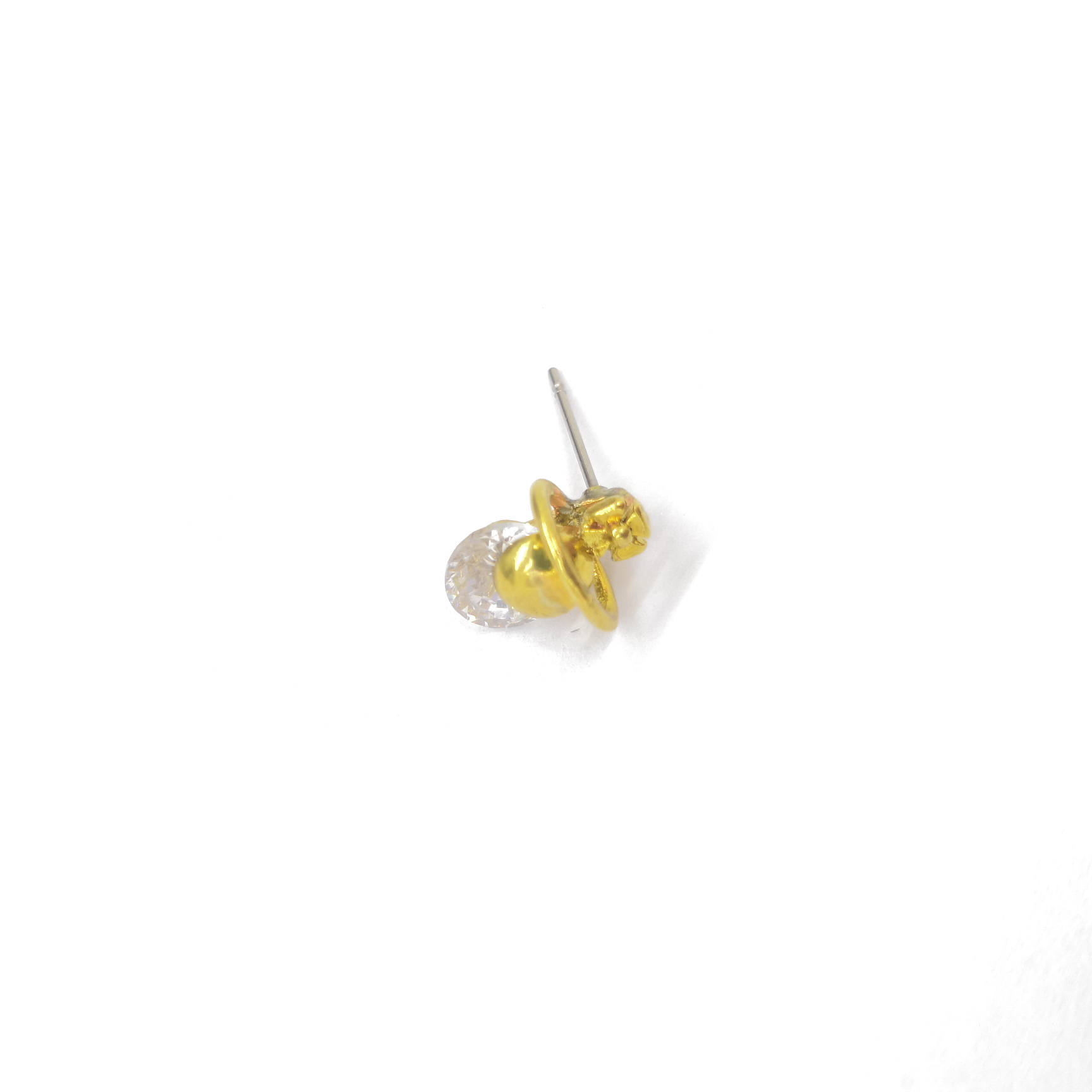 Cast-copper stud earrings with diamonds.
