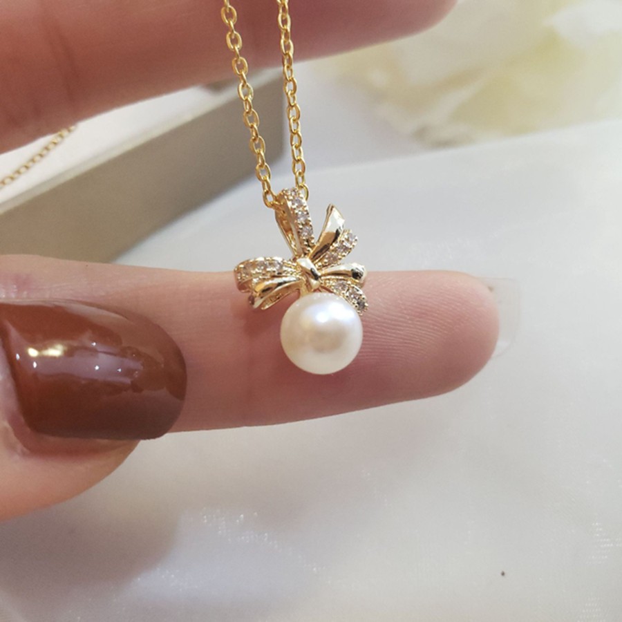 European and American fashion bow alloy inlaid acrylic pearl pendant ladies' cold necklace detail image 3