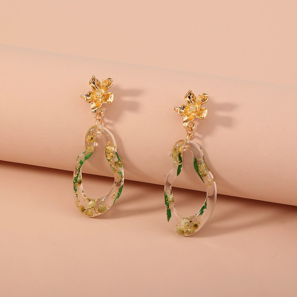 European and American exaggerated style hollowed-out resin inlaid with gold foil paper alloy double-panel ladies' cool stud earrings