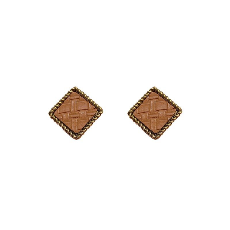 The base of the European and American light luxury alloy is pasted with artificial leather geometric lady's ear studs