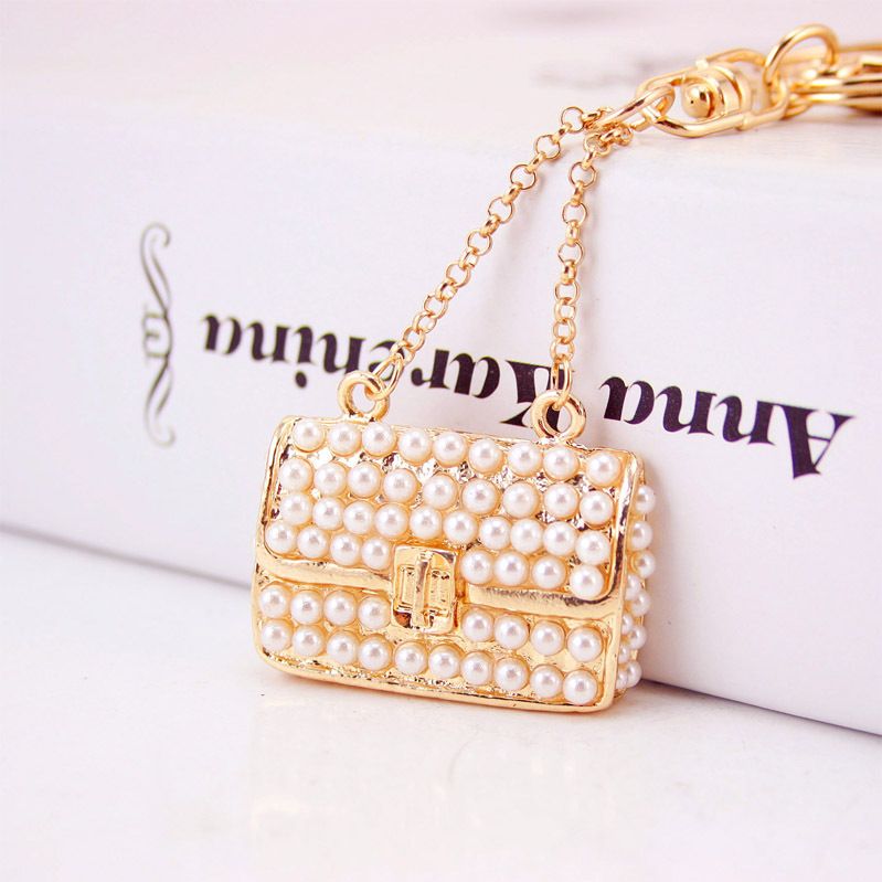 Fashionable and light luxury women's handbag inlaid with acrylic pearl car keychain women's bag accessories