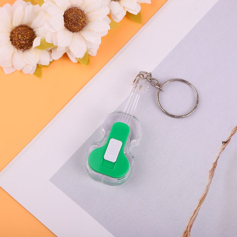 Creative summer new children's plastic toy, glowing violin keychain pendant, up and down switch iron buckle chain Application Scenario