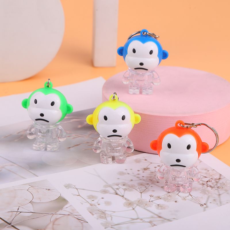 Creative summer new children's plastic toys: Glowing little monkey keychain pendant, up and down switch iron buckle chain, glowing toy, small gift, tall electronic toy 1