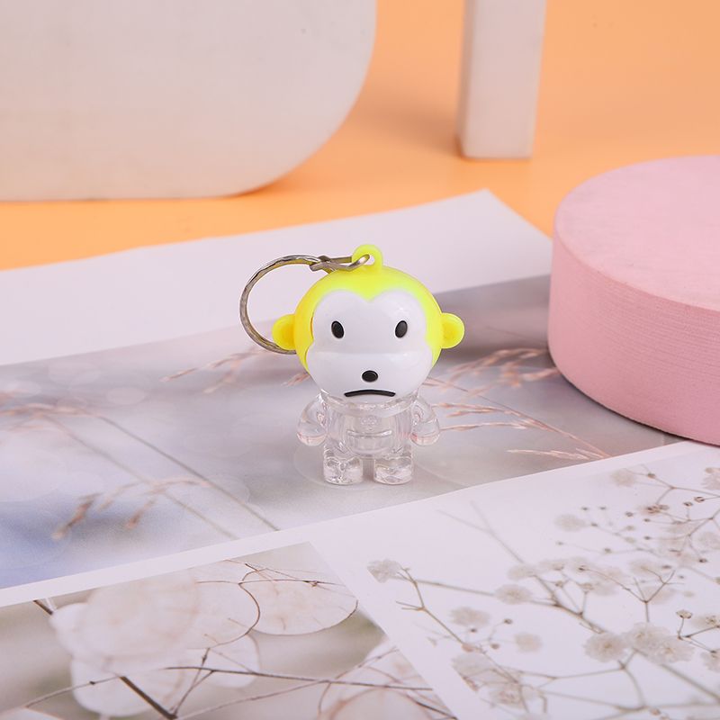 Creative summer new children's plastic toys: Glowing little monkey keychain pendant, up and down switch iron buckle chain, glowing toy, small gift, tall electronic toy 1 Application Scenario