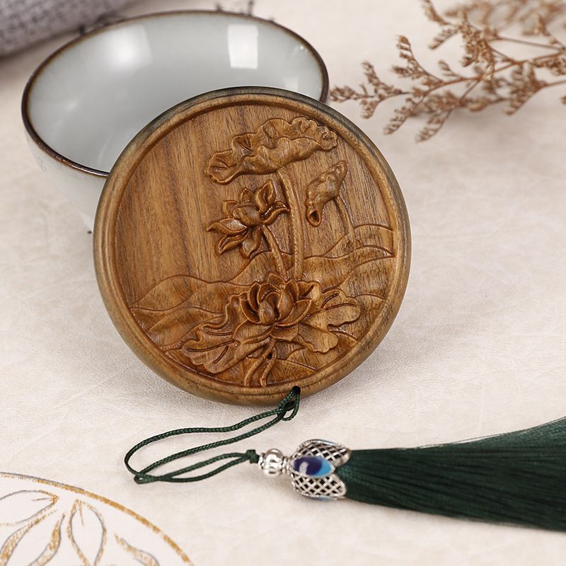 Portable round makeup mirror with green sandalwood carvings, lotus pond