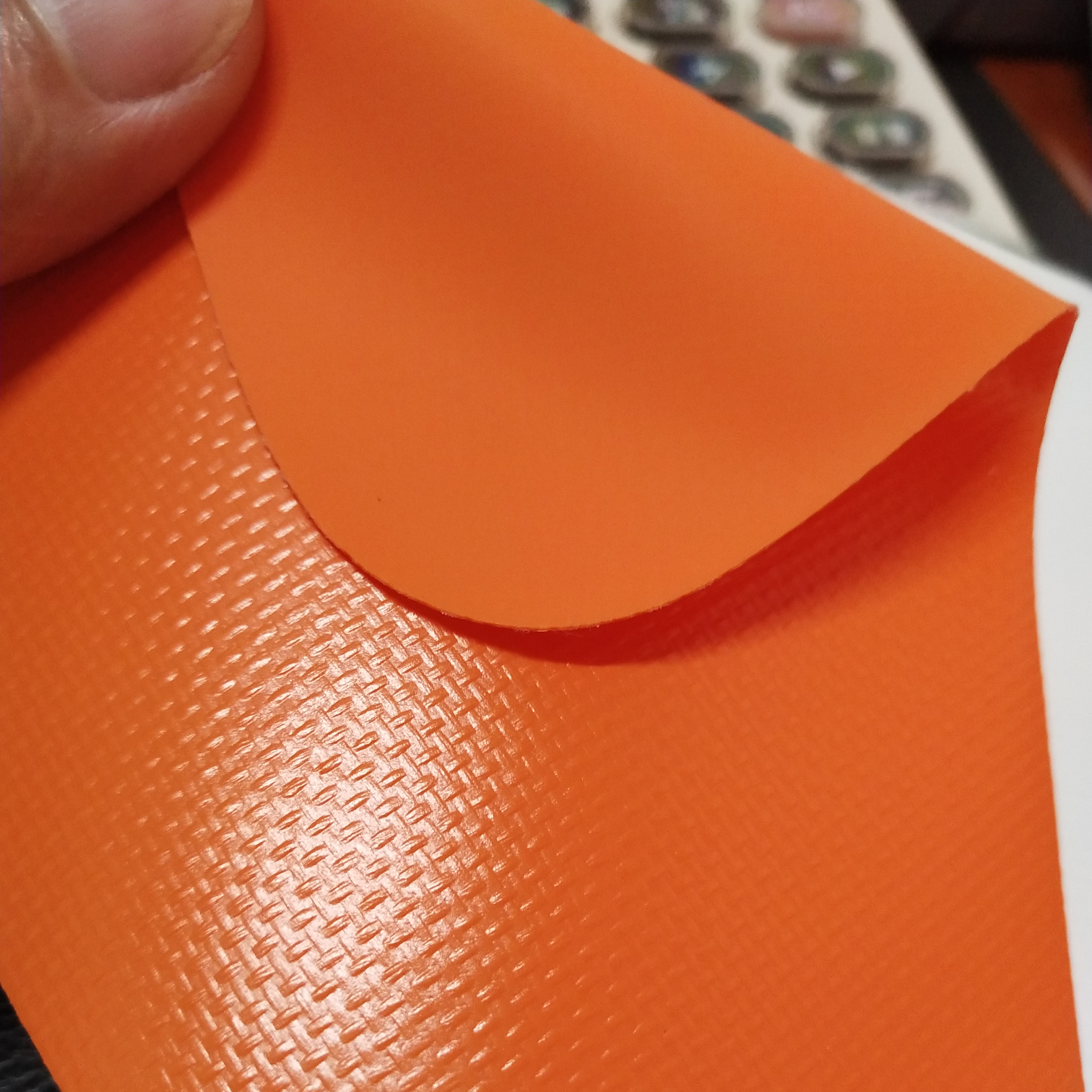 High-quality matte 0.55mm thick orange PVC mesh fabric for luggage, machine covers, furniture covers, sports and amusement products, various gymnastic MATS, and special fabric for various luggage bags