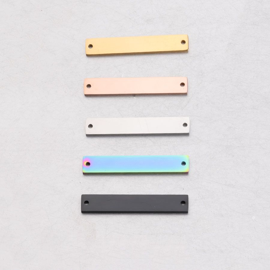 Mirror-finish stainless steel rectangular double-hole connectors in stock with geometric smooth surface tags that do not fade
