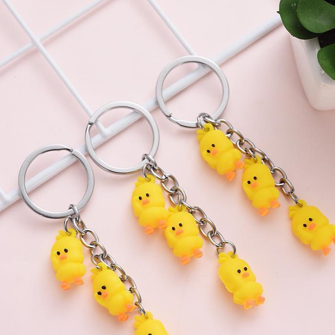 A string of three cute ducklings a series of keychains