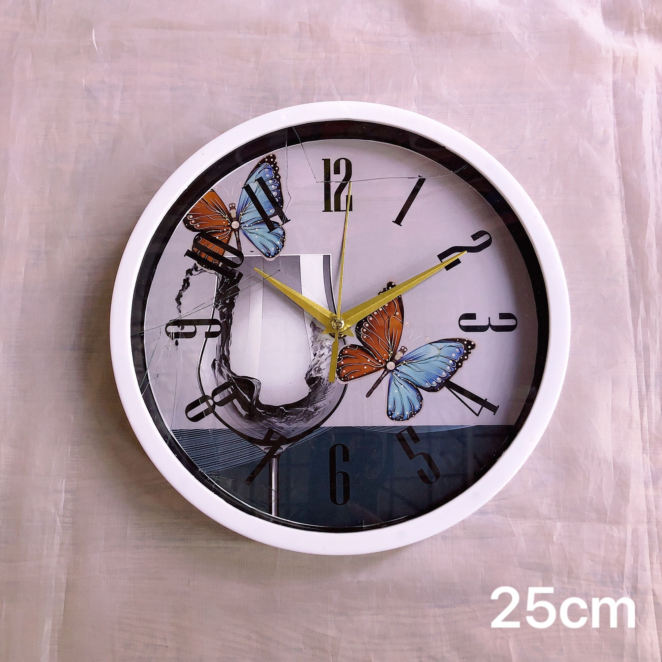 A 10-inch Nordic wall clock for living room wall decoration, a personalized and creative clock, a simple European-style household clock, 25cm details Picture