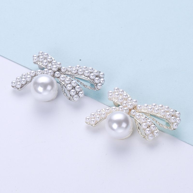 Manufacturers direct sales of foreign trade hot rice bead bow brooch elegant temperament clothes accessories