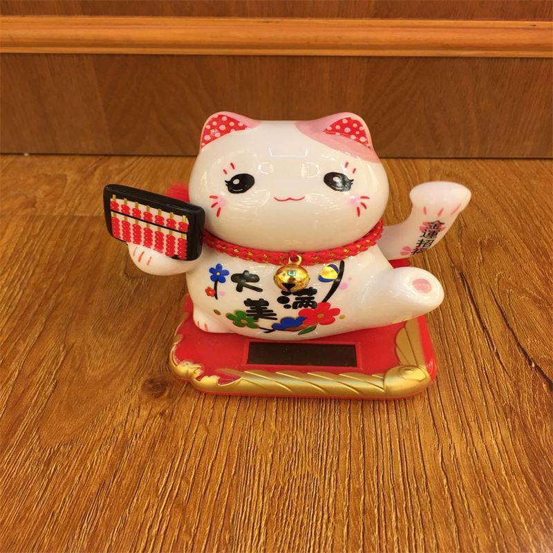 南泰算盘财入太阳能摇手猫车载摆件