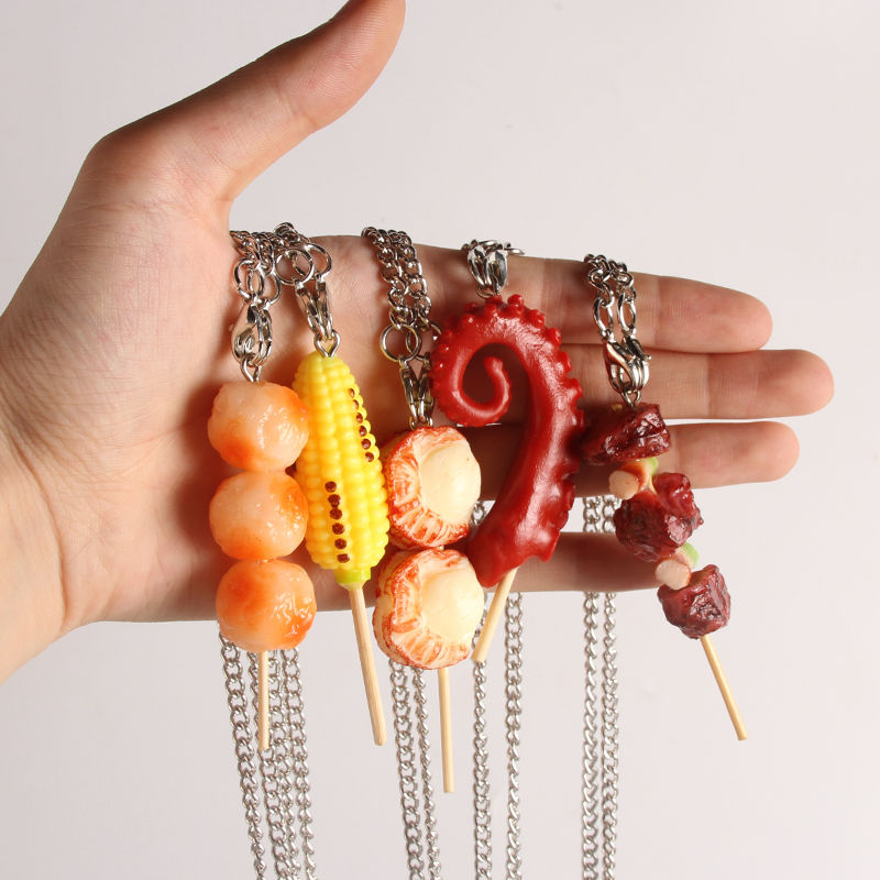 Anti-real lamb kebabs with fish and a chain necklace