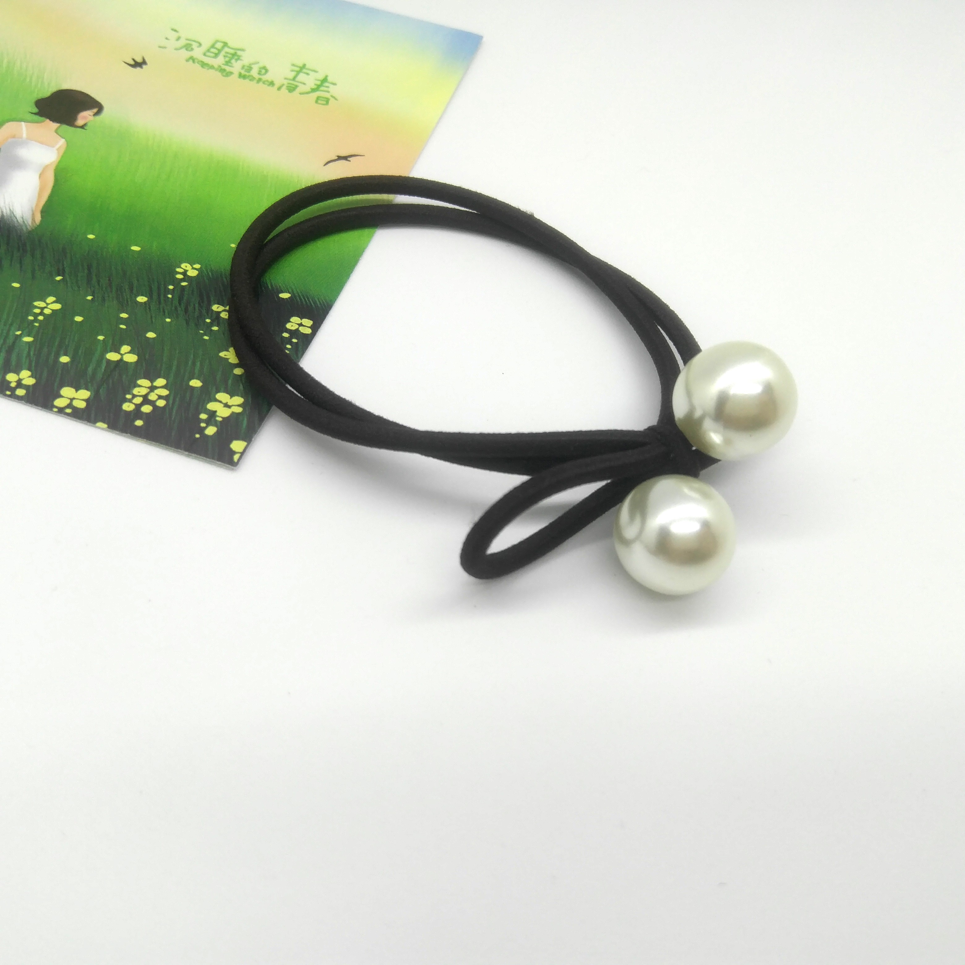Tie a large pearl bow with a round rubber band detail image 10