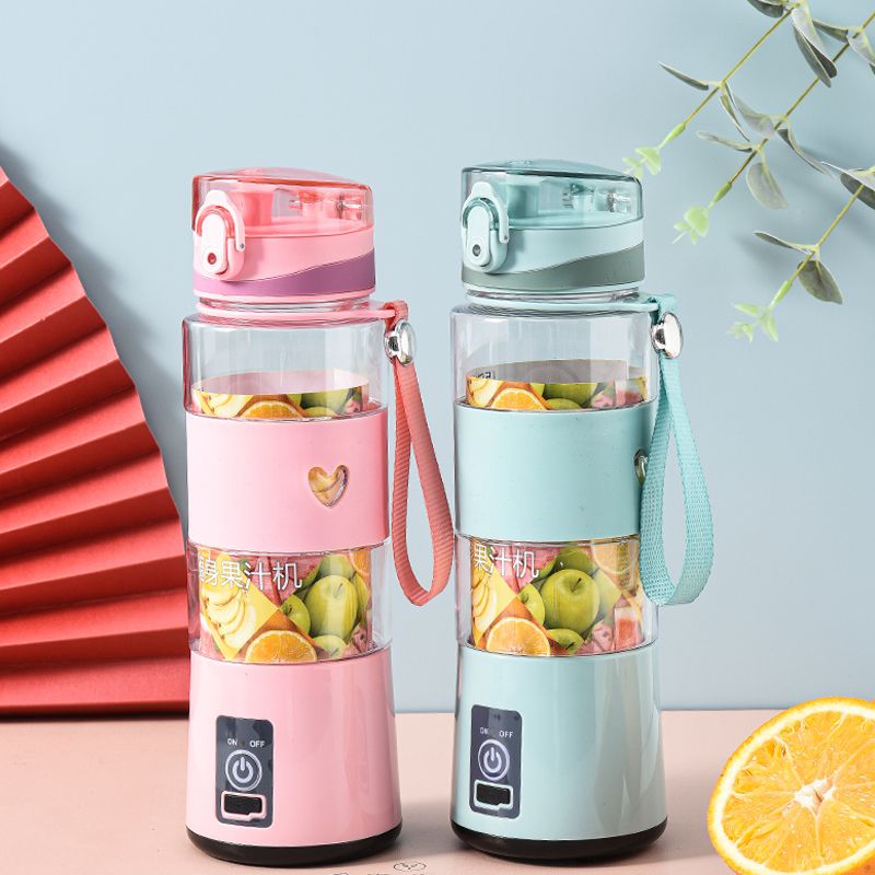 Portable juicer, household small fruit juicer, mini electric cup-shaped juicer, available in pink and green. Please make a note full figure
