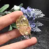 The natural titanium rutile pendant of the bright color crystal jewelry measures 37.6 millimeters in length, 18.6 millimeters in width and 9.32 millimeters in thickness details Picture