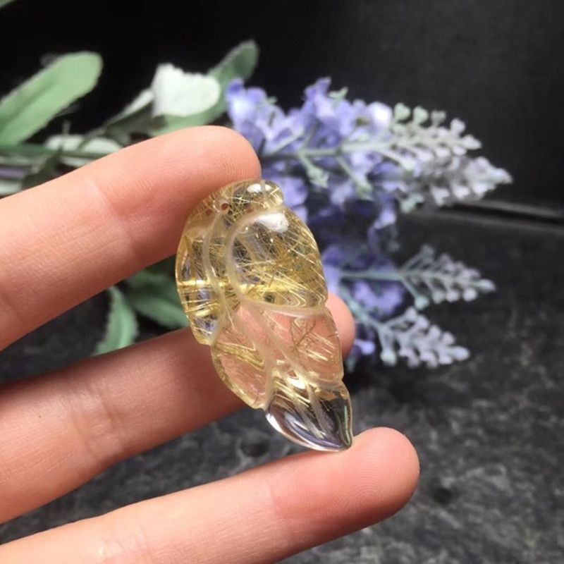 The natural titanium rutile pendant of the bright color crystal jewelry measures 37.6 millimeters in length, 18.6 millimeters in width and 9.32 millimeters in thickness