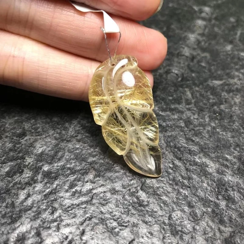 The natural titanium lustrous crystal jewelry pendant with jade branches and leaves is even more beautiful detail image 1