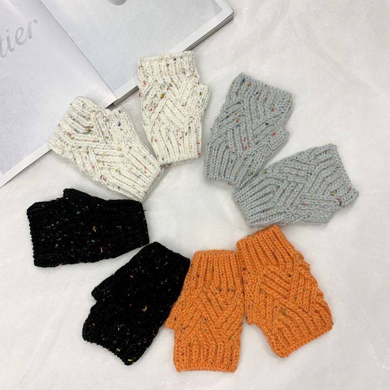 Autumn and winter knitted woolen hats and gloves, simple, fashionable and elegant, iron label rolled-up hat, Japanese-style Baotou cold hat, European and American trendy ins full figure