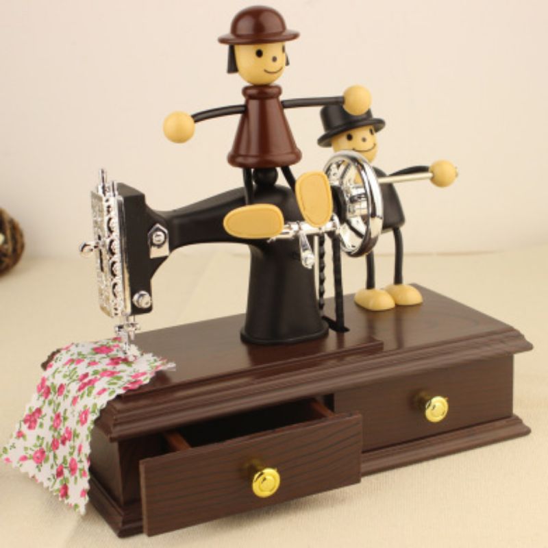 Imitation wooden sewing machine spring, retro music box, jewelry box, romantic couple puppet, music box, creative gift details Picture