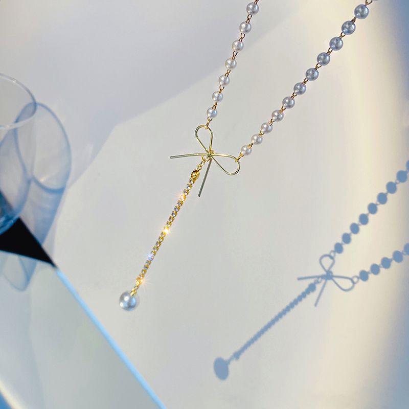 Korean version luxurious and elegant bow long pearl tassel pendant necklace, light luxury goddess style collarbone chain Specification image