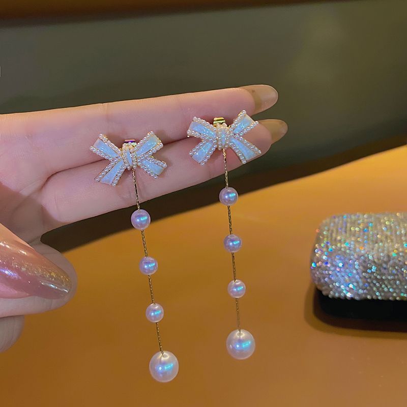 High-end bow pearl earrings for women's autumn 2021 new, niche design, stud earrings, ear clips, and silver needle earrings Specification image