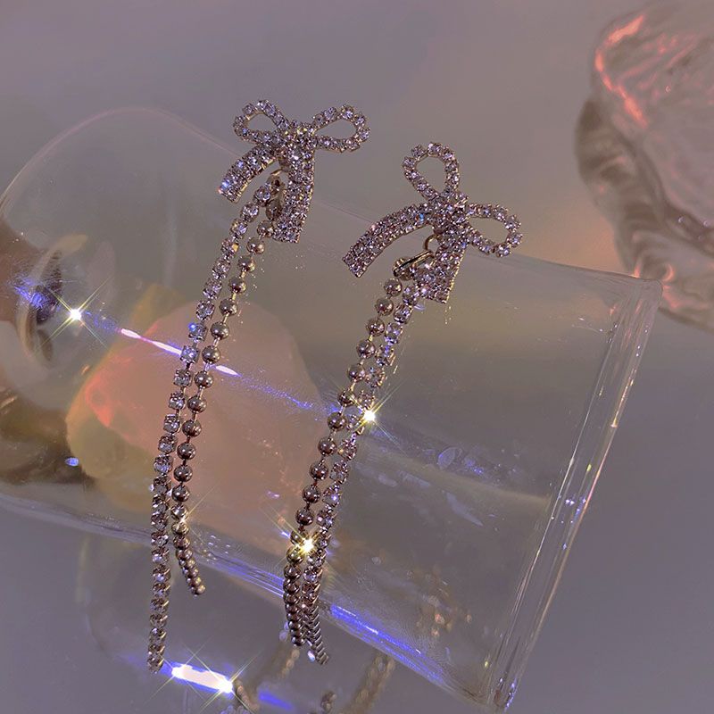 Korean-style light luxury sparkling diamond bow earrings, 2021 new trendy tassel long earrings, women's ear clips and stud earrings Application Scenario